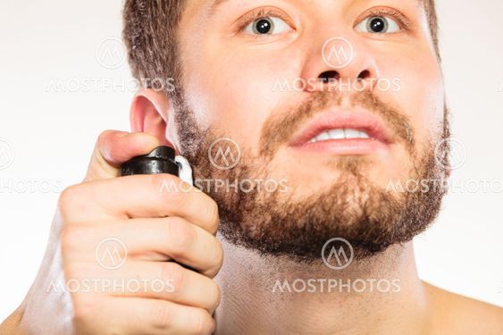 Young handsome man with shaving cream foam can.