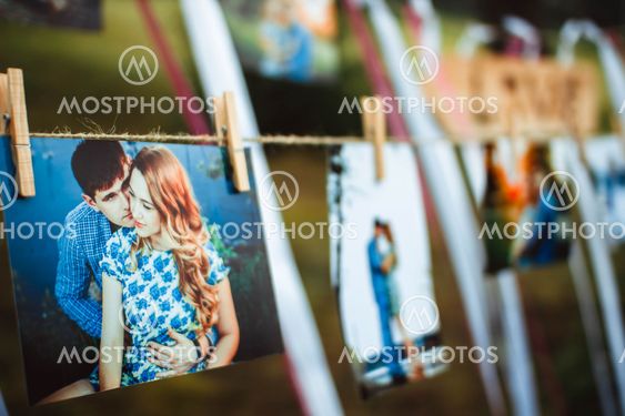 photos hanging on a rope
