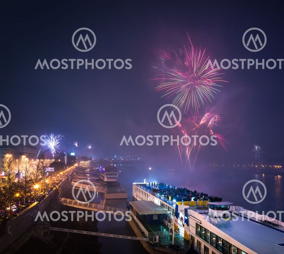 Passenger Boat with Fireworks in Background