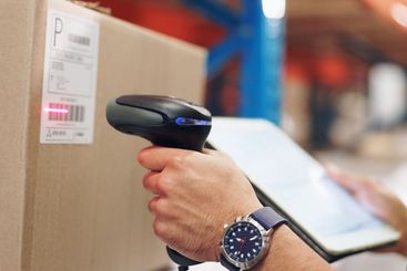 Logistics, hands and man scanning barcode in warehouse...