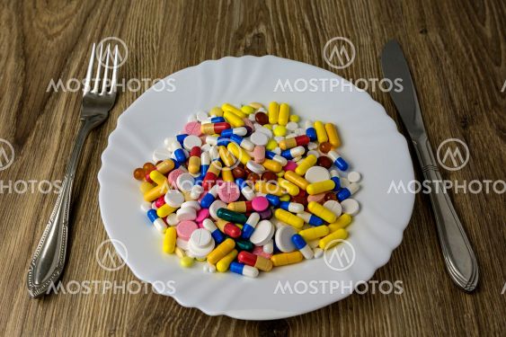 A bunch of pills on a plate