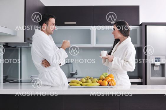 young couple have fun in modern kitchen