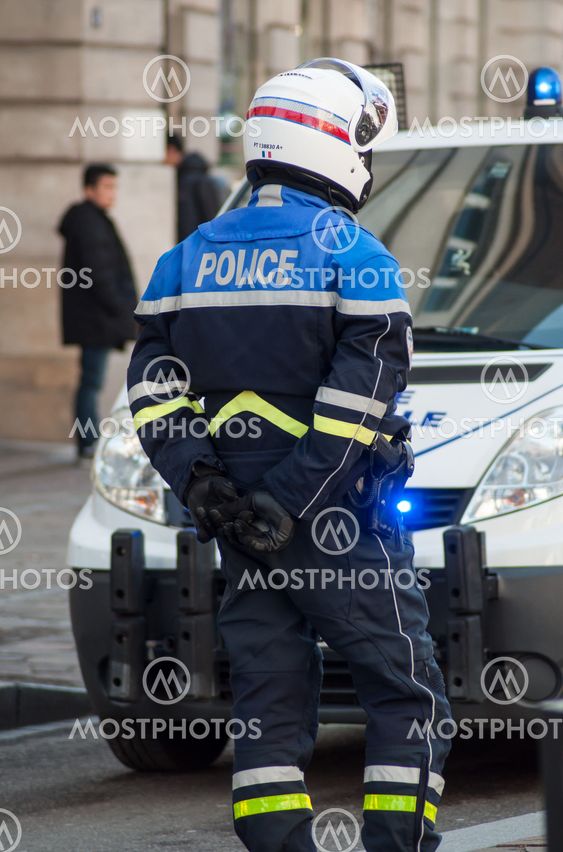 biker of the national police making the traffic, during a demonstration people protesting in the street against taxes and rising fuel prices
