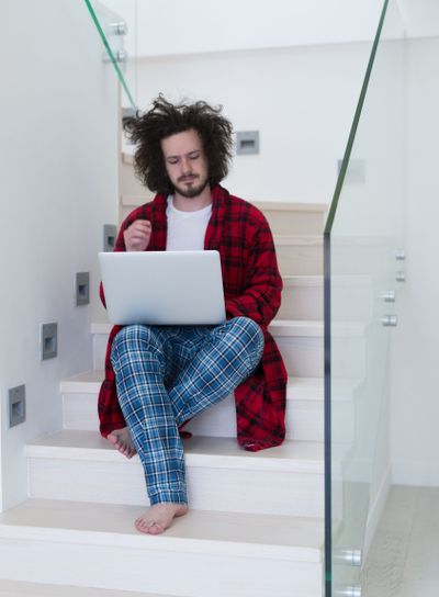 freelancer in bathrobe working from home