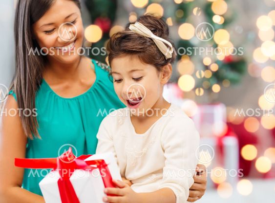 happy mother and little girl with gift box