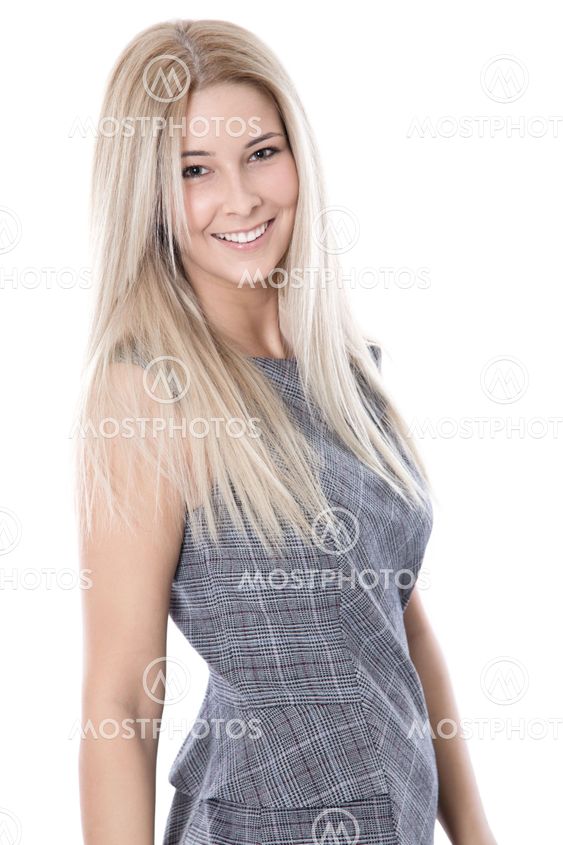 Smiling beautiful young businesswoman over white...