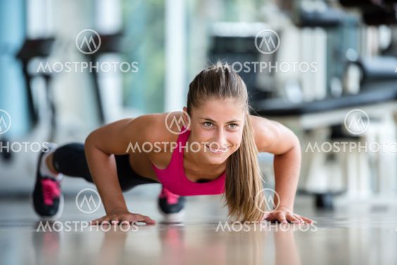 warming up and doing some push ups a the gym