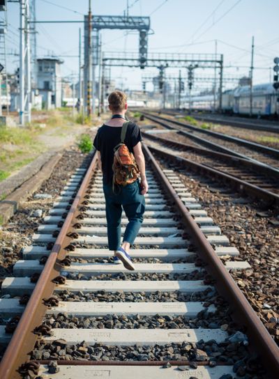 hipster modern stylish blonde man on rails