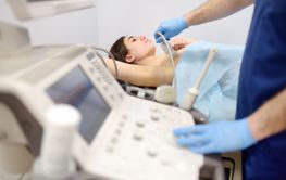 Mammologist doctor examines a woman breasts and lymph...