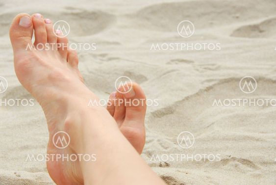 Woman feet beach