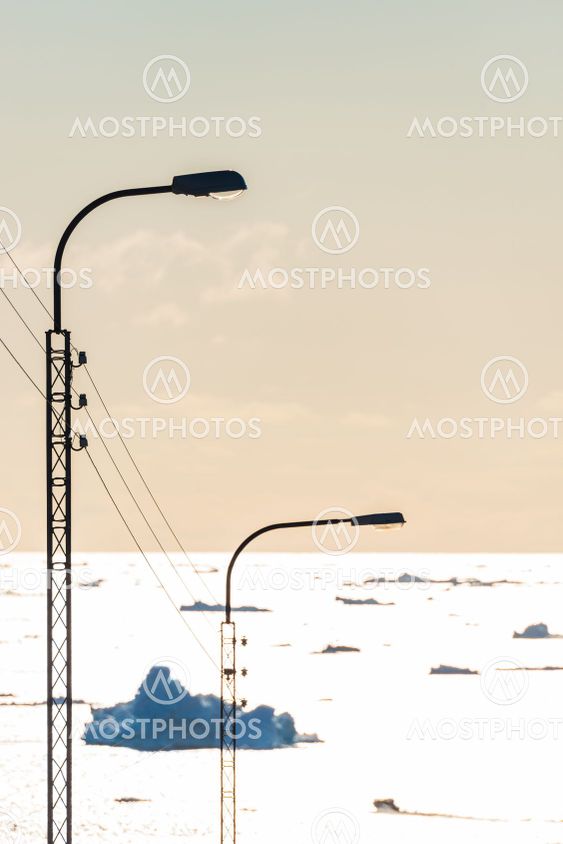 Street lamp in front of sea