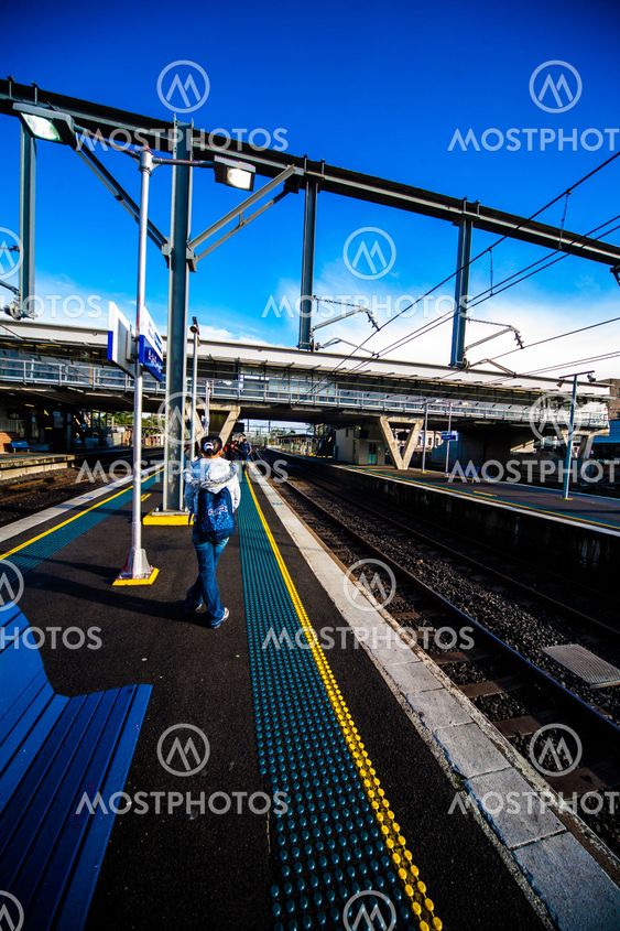 Morning at train station platform with safety dots