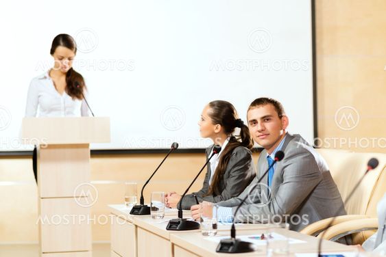 businessmen communicate at the conference