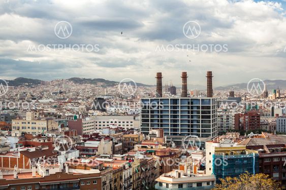 Barcelona city under cloudy sky overview