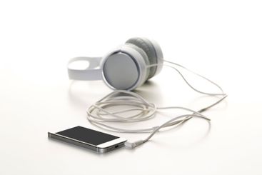 White headphones on white background close up