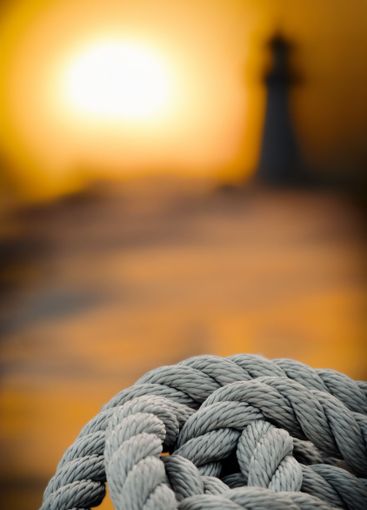 Sunset Lighthouse And Mooring Rope