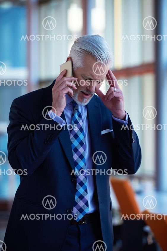 senior business man talk on mobile phone