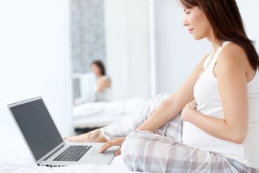 Laptop, motherhood and pregnant woman for research,...
