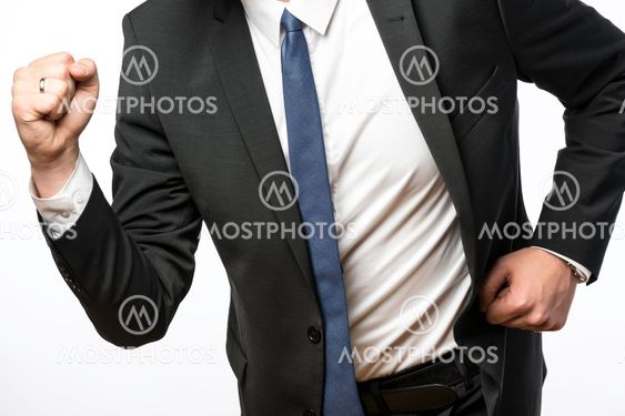 Businessman on the move with clenched fists