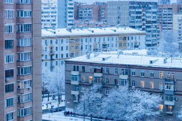 apartment houses in blue winter evening twilight