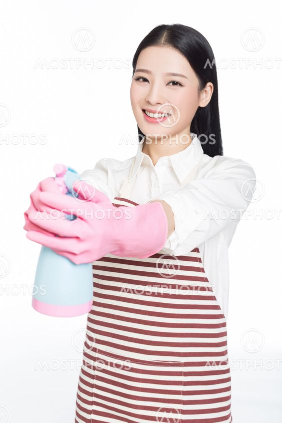 young woman cleaning on white