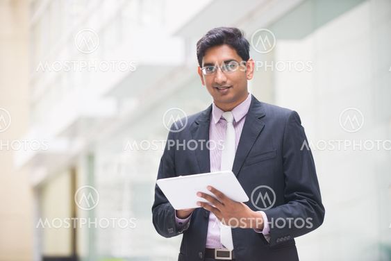 indian business male with a tablet