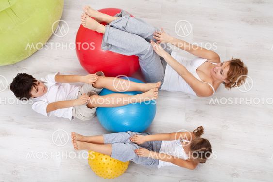 Woman and kids exercising together