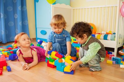 Kids playing with plastic blocks