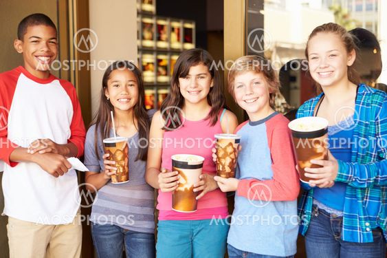 Group Of Children Standing Outside Cinema Together