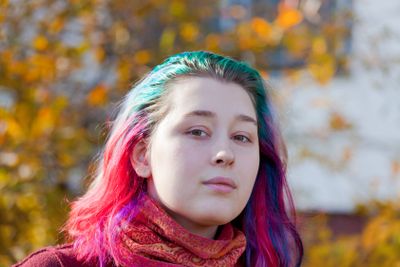 young woman with multicoloured streaks hair