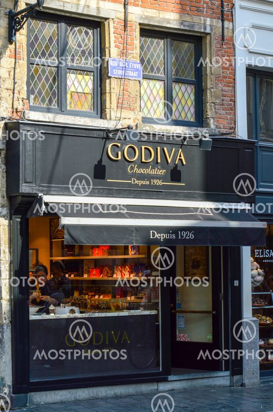 Brussels, Belgium - April 2015: Outlet of Godiva, a manufacturer of premium fine Belgian chocolates, truffles, and holiday gifts, at Manneken Pis branch in Brussels, Belgium