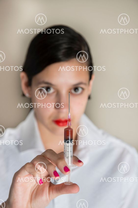 Beautiful women holding syringe
