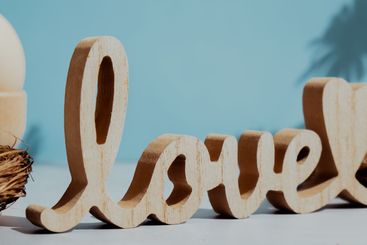 Wooden word LOVE traditional greeting to christian...