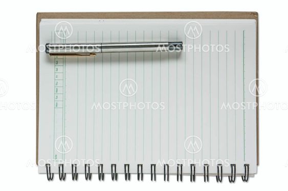 A pen on a spiral notebook