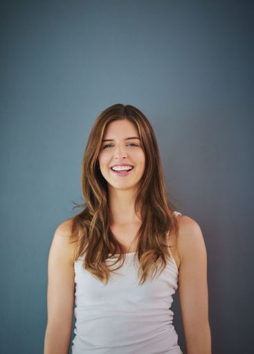 Portrait, happy woman and smile with joy, cute and...