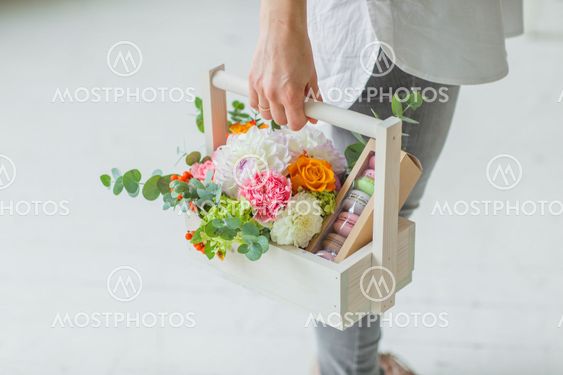 Spring gift in the hands of women. Flower arrangement in...