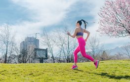 Woman running fast for sport on sunny day