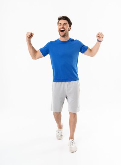 Full length photo of happy man in shorts and t-shirt...