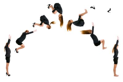 Business woman making  a front flip