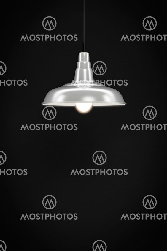 white lamp in front of a dark wall