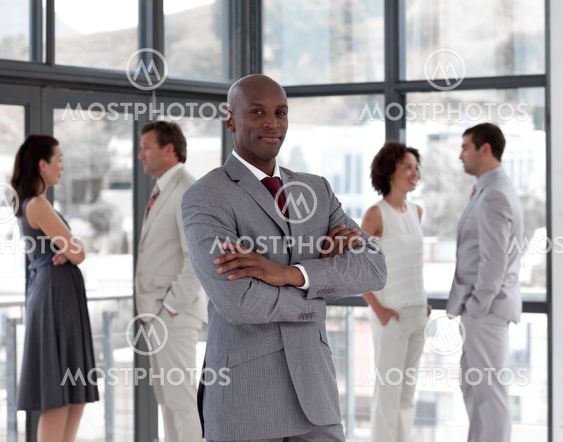 portrait of a confident male manager leading his team