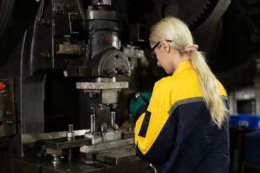 caucasian women worker working in heavy metal industry...
