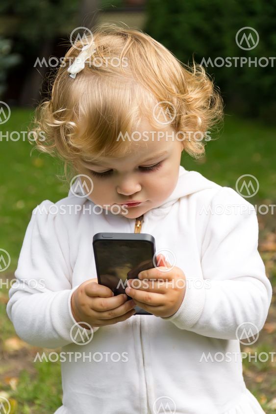 Cute infant with cellular