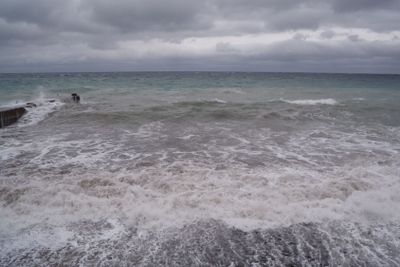 View of storm seascape. Dark moody sky over the gray...