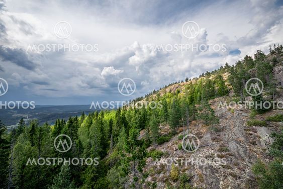 Sunlight at a mountainside during bad weather