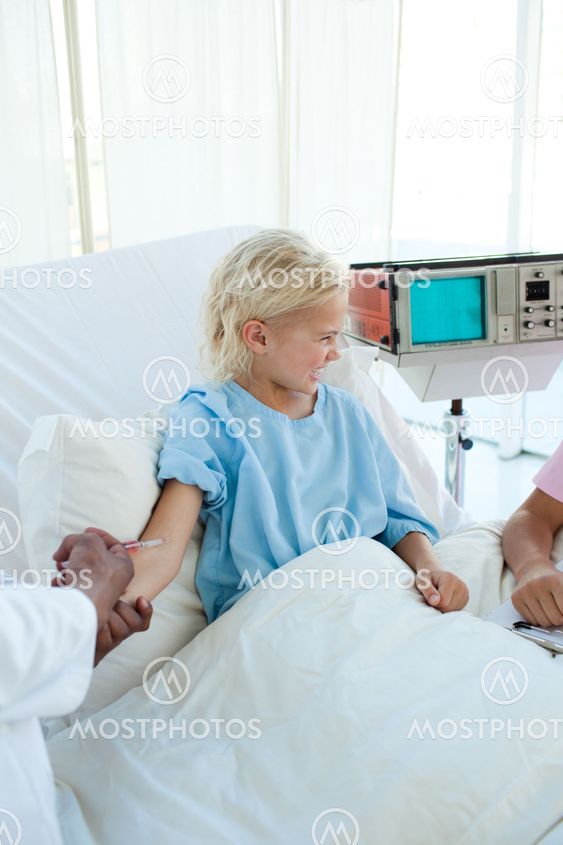Afraid child patient receiving an injection
