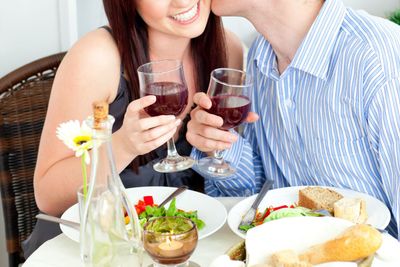 Close-up og a happy boyfriend kissing his beautiful...