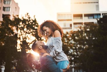 Smile, happy and couple in city lift for fun, playful...