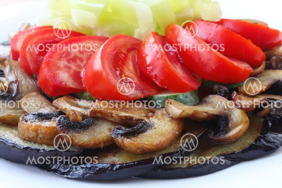 Fried eggplant and mushrooms with fresh vegetables