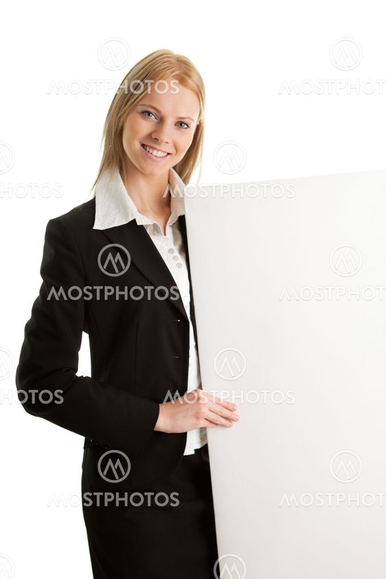 Cheerful businesswomen presenting empty board